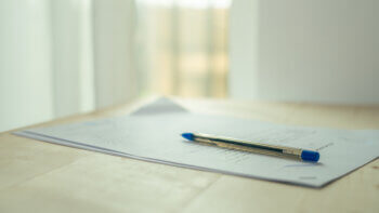 pen sitting on top of document